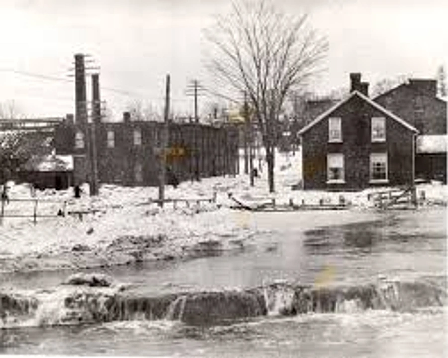 Historic winter view of Oshawa Creek and the surrounding community